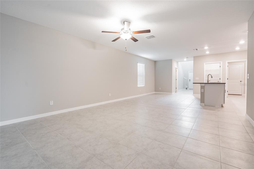 31807 Barrel Wave Way Wesley Chapel, FL 33545 - Photo 40 of 61 a view of a kitchen with a sink and a refrigerator