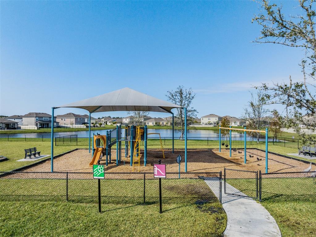 31807 Barrel Wave Way Wesley Chapel, FL 33545 - Photo 51 of 61 a view of a park with swings on the wall