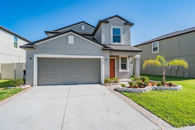 a front view of house with yard