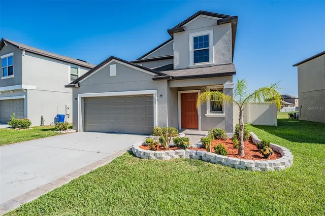 a front view of a house having yard