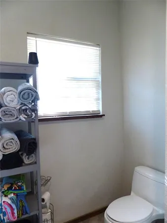 a bathroom with a toilet and a sink