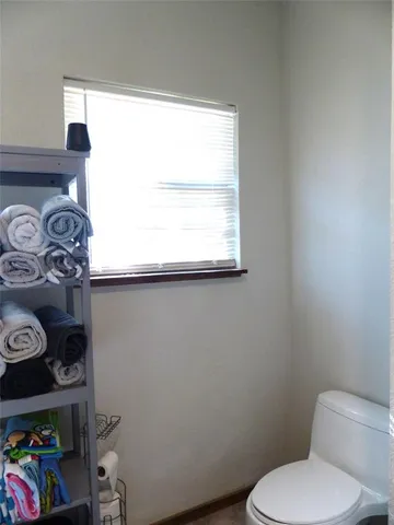 a bathroom with a toilet and a sink