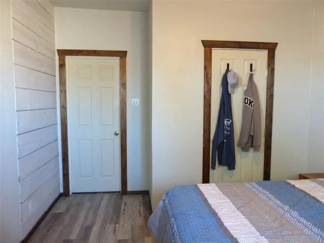 a bedroom with a bed and a mirror