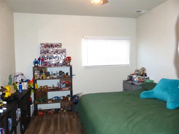a room with toys and a wooden floor