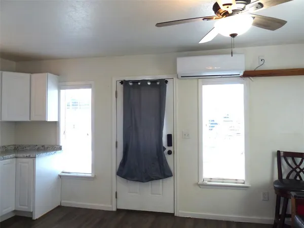 a kitchen with stainless steel appliances granite countertop a refrigerator and a window