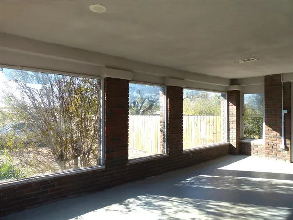 a view of an empty room and window