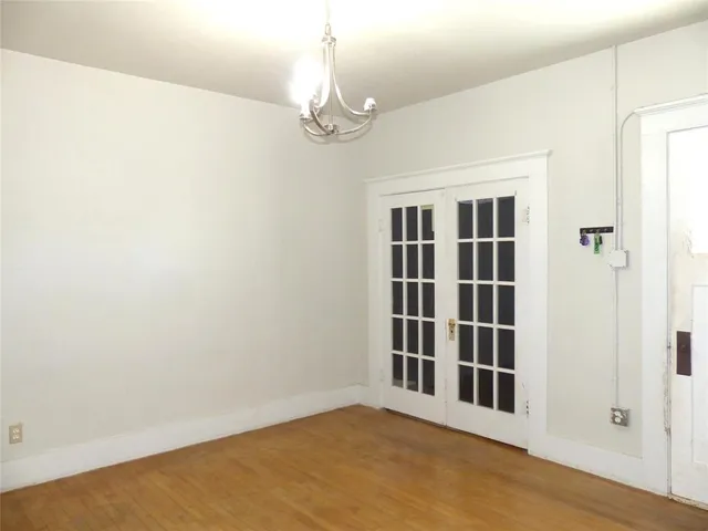 a view of empty room with windows