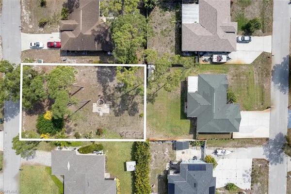 an aerial view of a house with a lake view