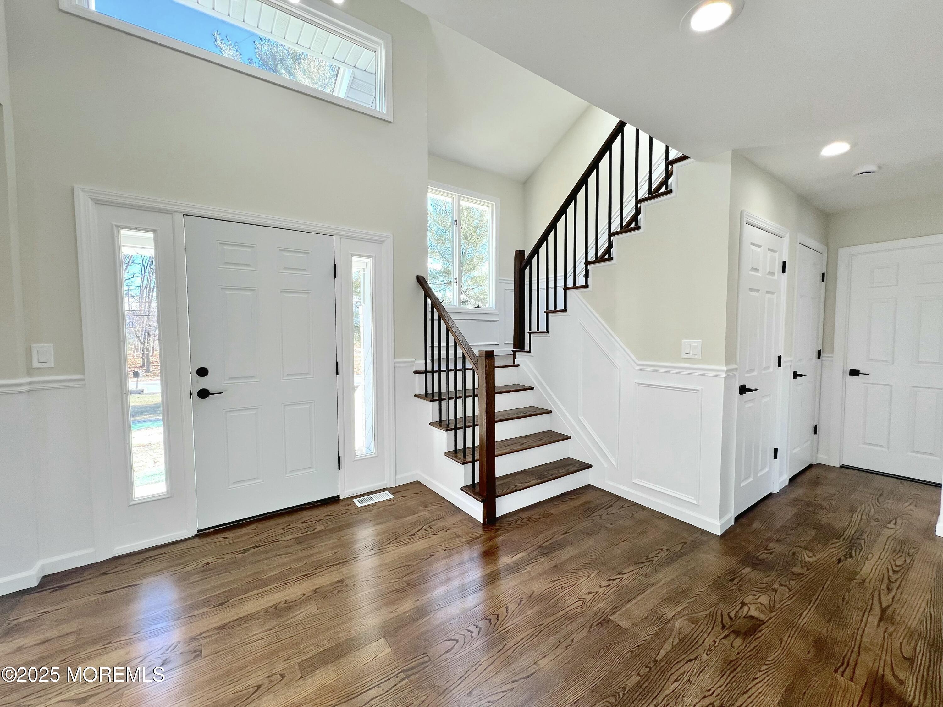 155 Hamilton Road Tinton Falls, NJ 07724 - Photo 47 of 49 a view of entryway with wooden floor and stairs