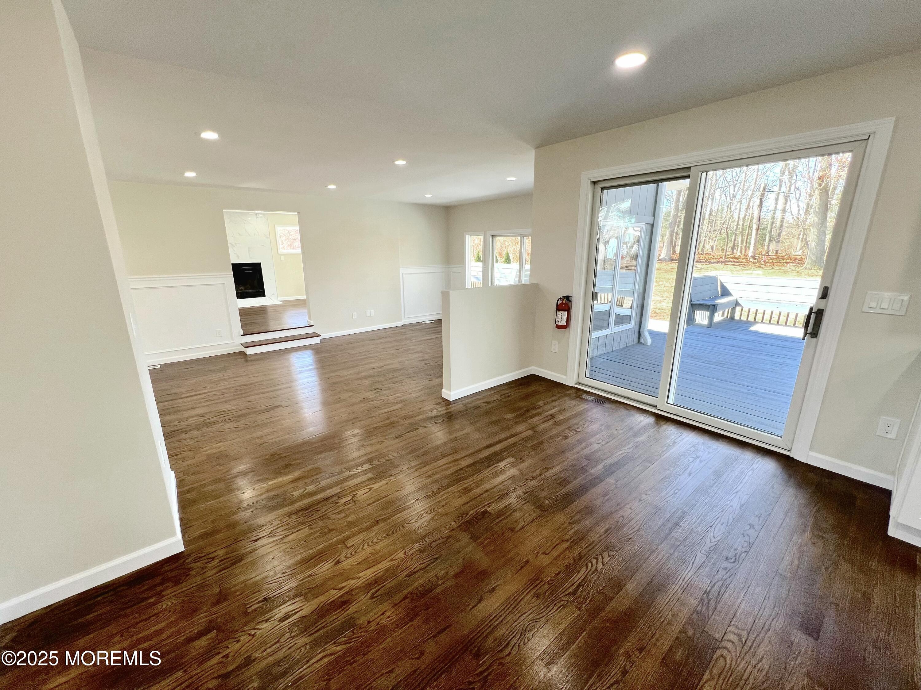 155 Hamilton Road Tinton Falls, NJ 07724 - Photo 5 of 49 a view of empty room with wooden floor and fan
