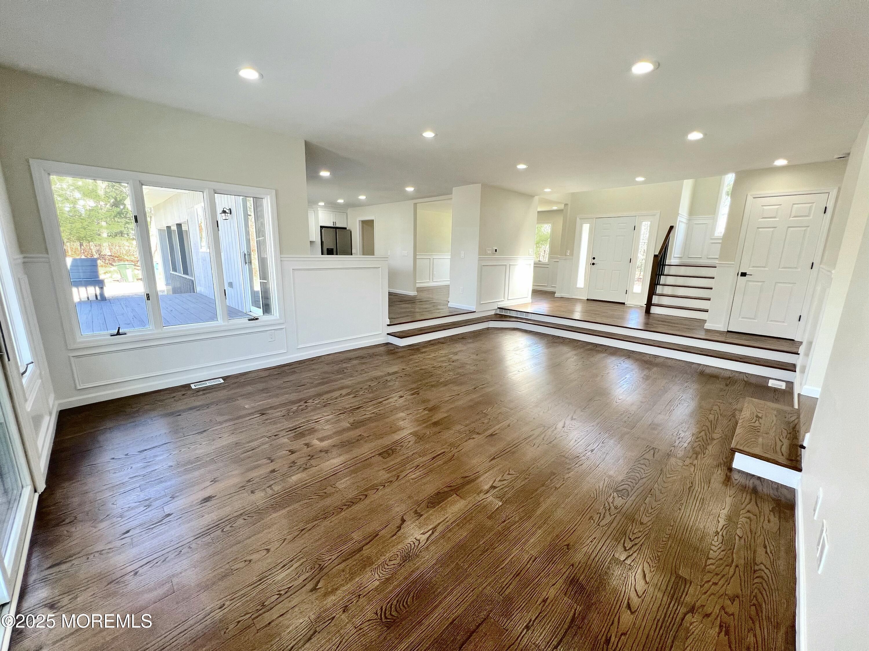 155 Hamilton Road Tinton Falls, NJ 07724 - Photo 8 of 49 a view of an empty room with wooden floor and a window