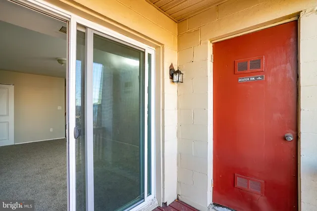 a view of a yard with cars parked