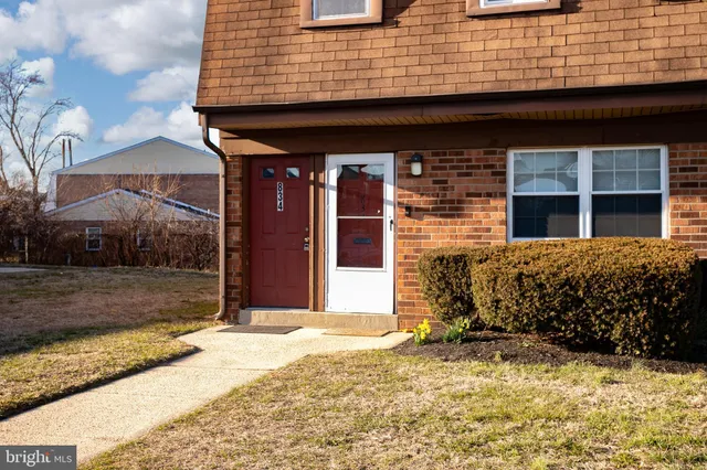 a view of a brick house with a large windows