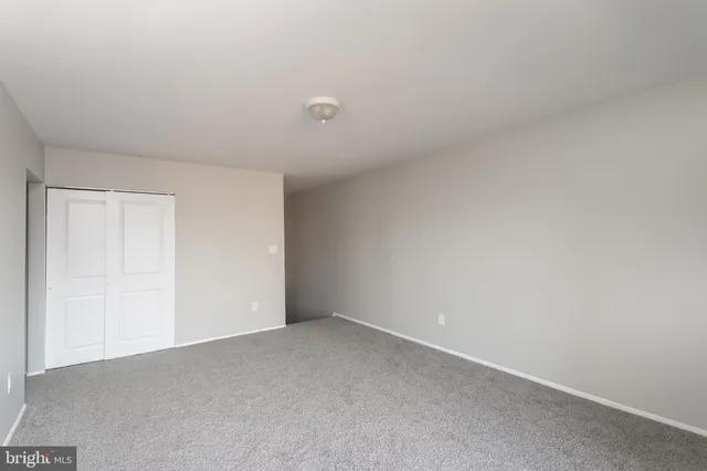 a view of an empty room and entryway