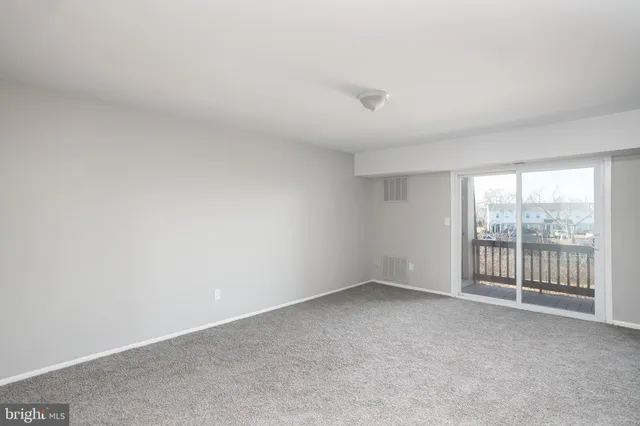 an empty room with glass door