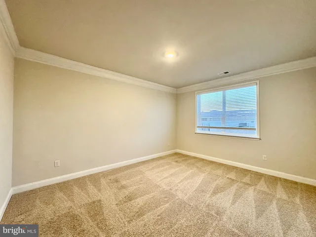 a bathroom with a sink toilet and a mirror