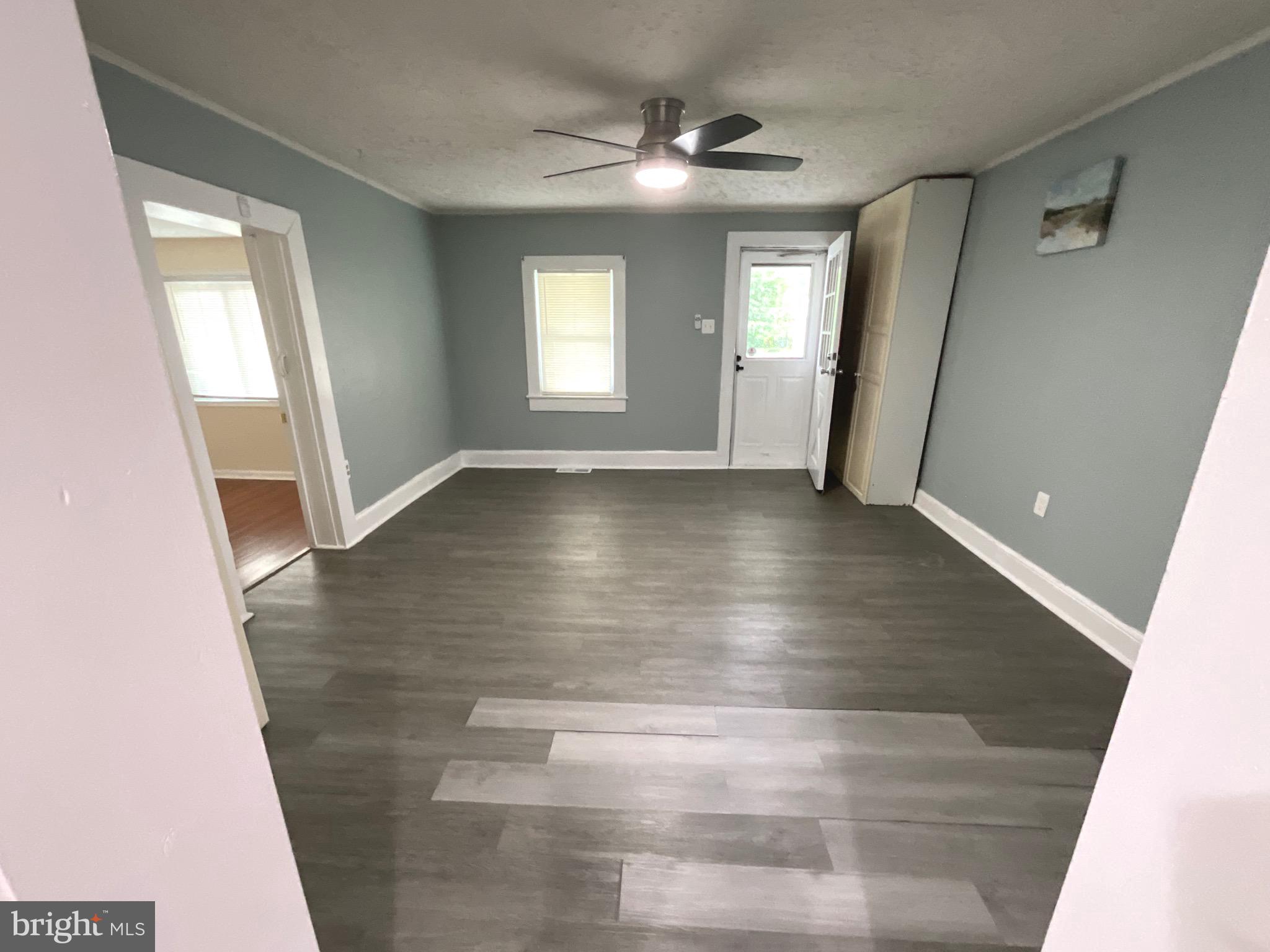 86 Kelley Road Fredericksburg, VA 22405 - Photo 6 of 36 wooden floor in an empty room with a window