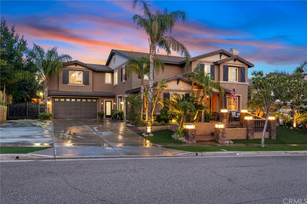 5513 Glen Ridge Court Rancho Cucamonga, CA 91739 - Photo 1 of 1 a front view of a residential apartment building with yard and parking