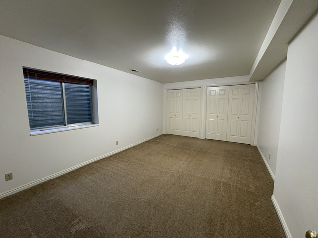486 West 120 North Orem, UT 84057 - Photo 18 of 30 Spacious room featuring neutral carpeting and white walls