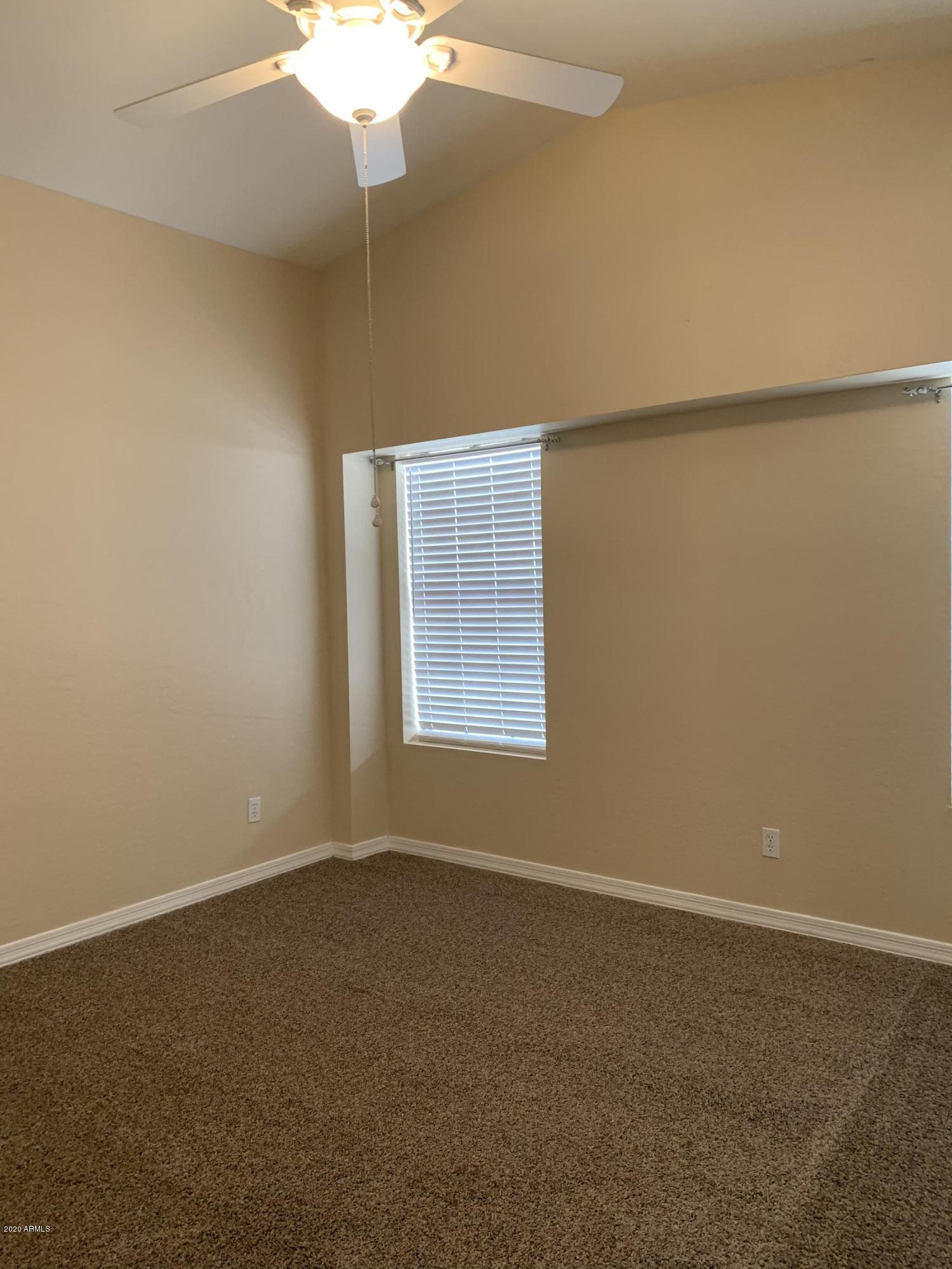 1500 North Sunview Parkway, Unit 20 Gilbert, AZ 85234 - Photo 5 of 12 an empty room with a window
