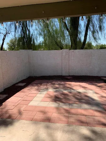 a view of a house with a wooden fence