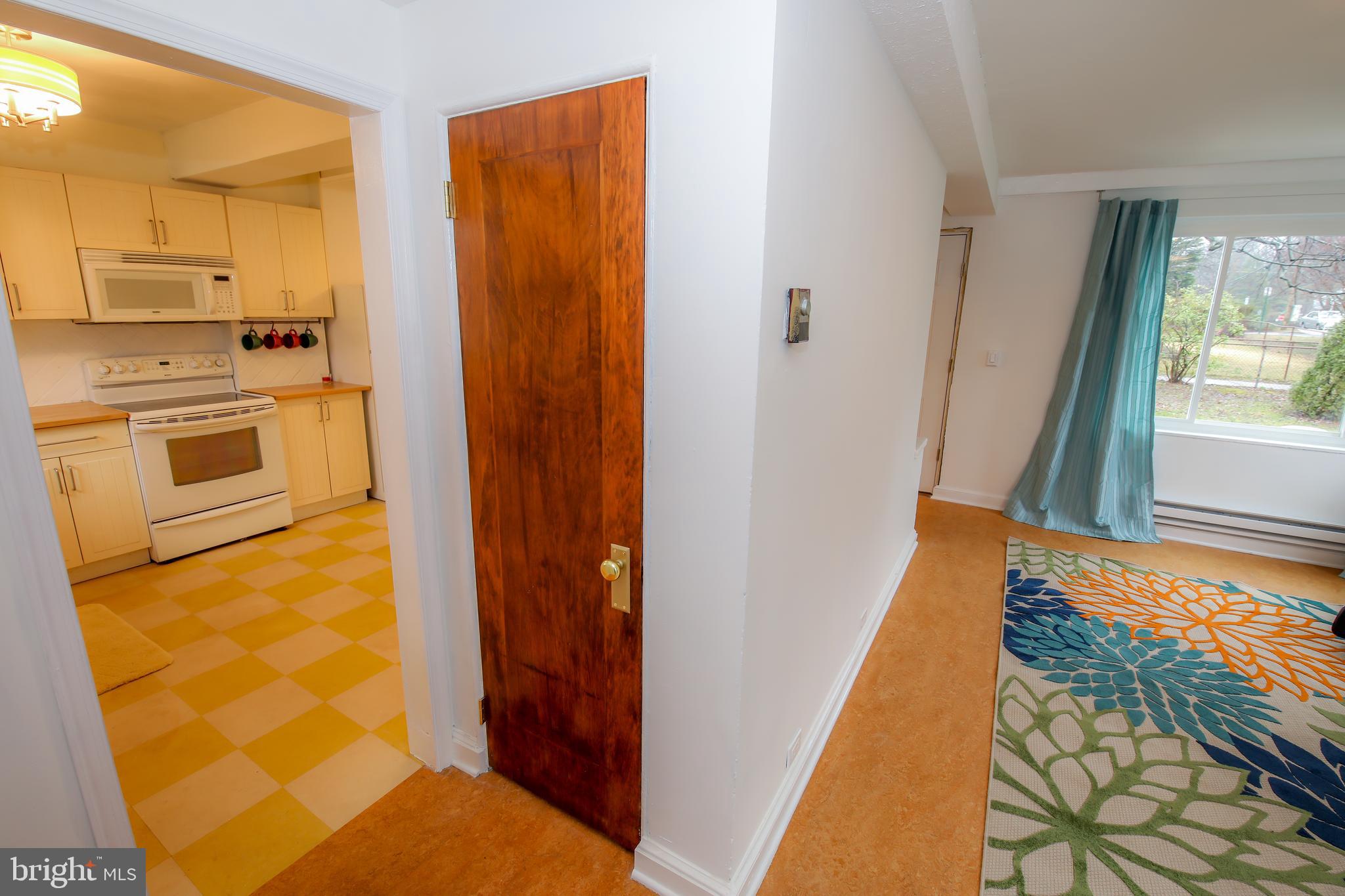 10 Hillside Road, Unit A Greenbelt, MD 20770 - Photo 9 of 44 Front entry, kitchen at left, living room at right