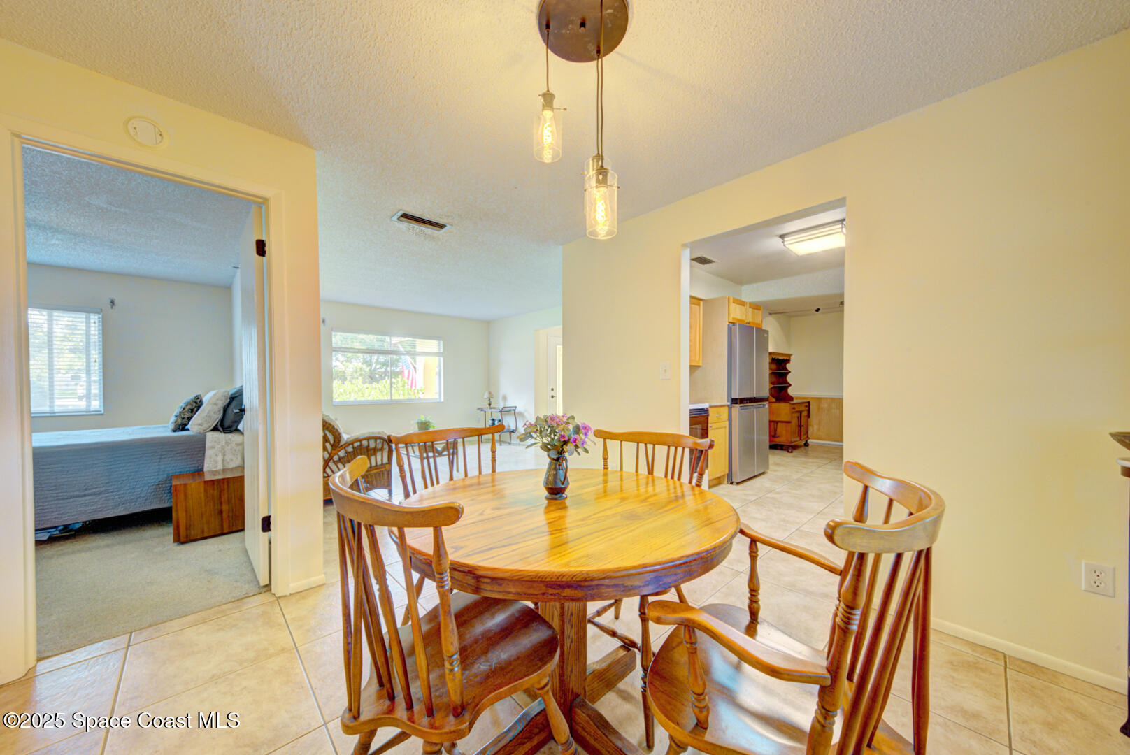 4610 Dunsford Road Titusville, FL 32796 - Photo 16 of 28 dining room with pendant lights
