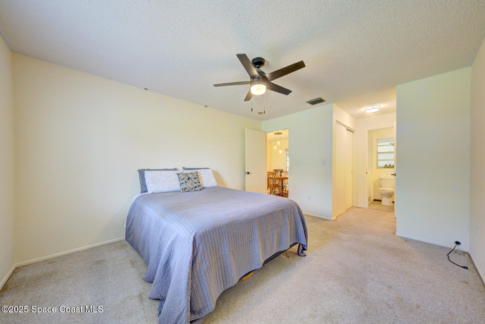 4610 Dunsford Road Titusville, FL 32796 - Photo 17 of 28 master bedroom with ensuite