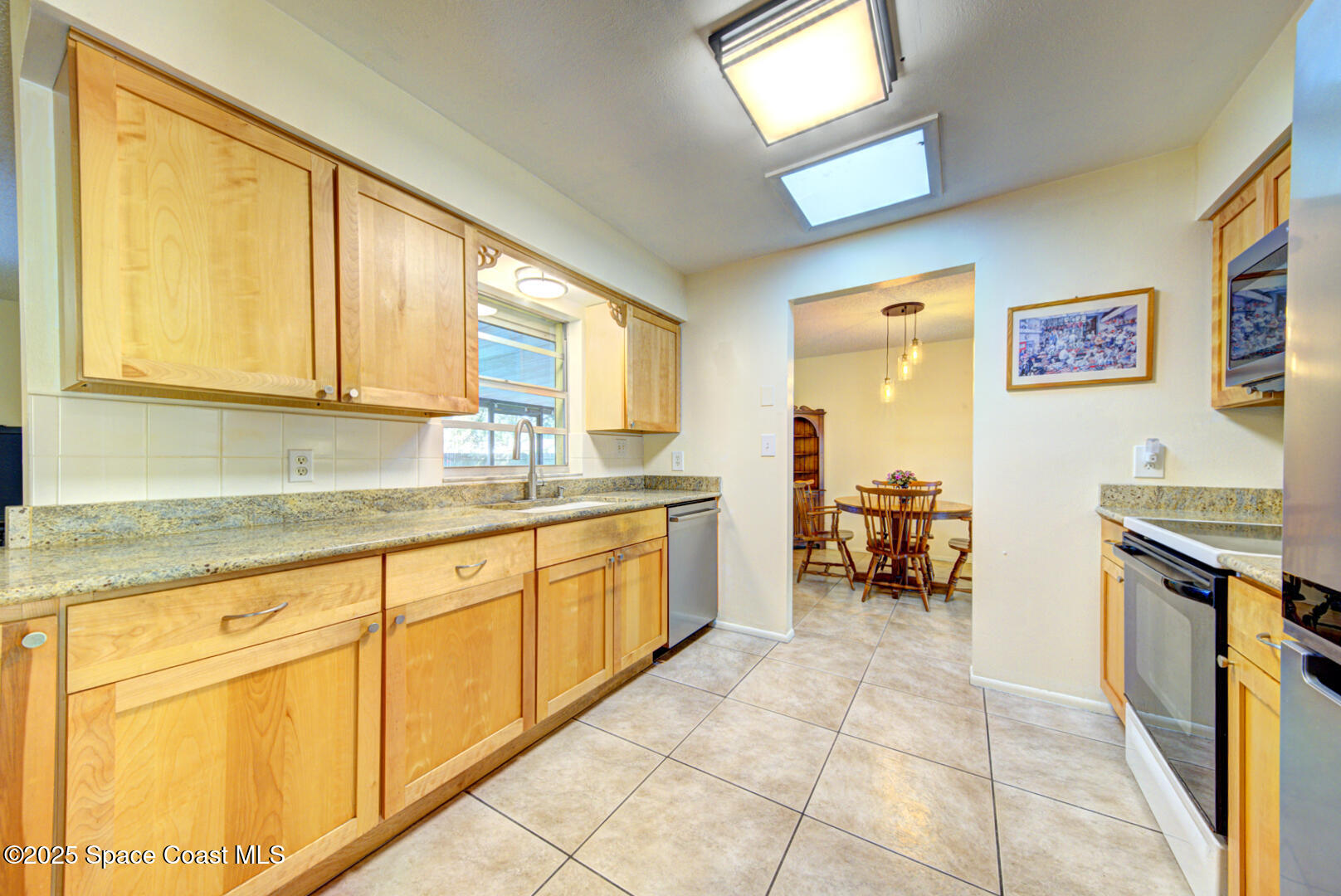 4610 Dunsford Road Titusville, FL 32796 - Photo 2 of 28 kitchen with door to dining room