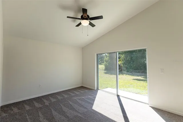 a view of an empty room and a window