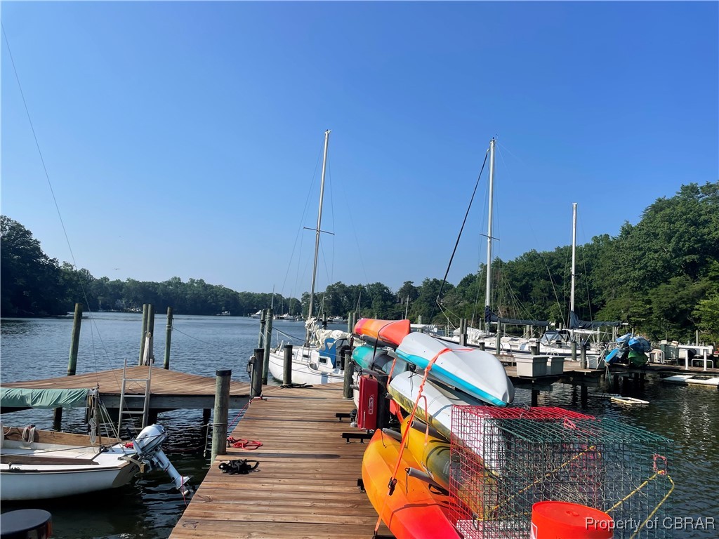 68 Villa Ridge Drive, Unit 4F Hartfield, VA 23071 - Photo 14 of 23 Dock featuring a water view and a wooded view