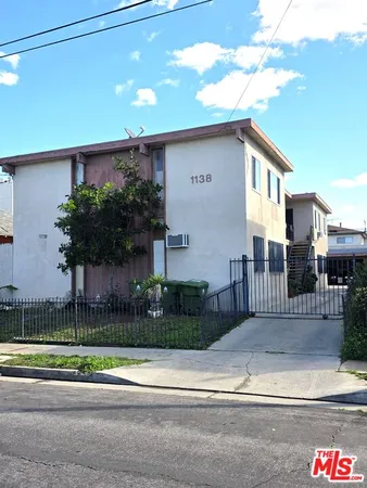 a view of a house with a street