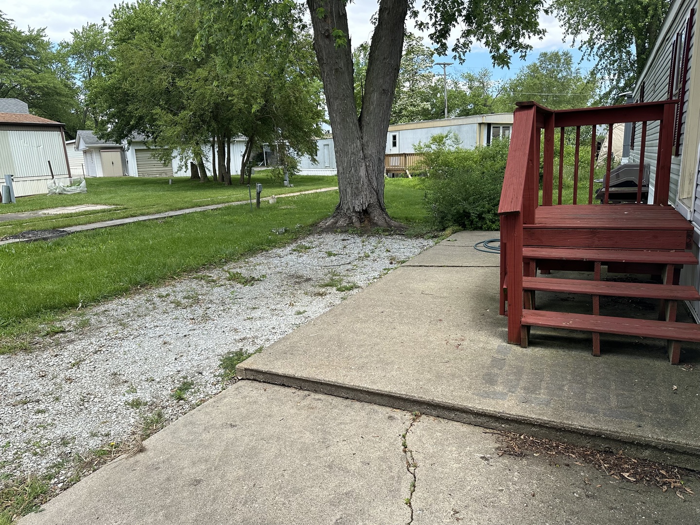 10557 North State Rte 50, Unit 11 Manteno, IL 60950 - Photo 2 of 11 a view of a house with a yard