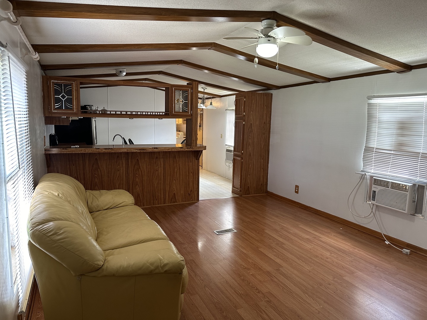 10557 North State Rte 50, Unit 11 Manteno, IL 60950 - Photo 5 of 11 a living room with furniture and a fireplace