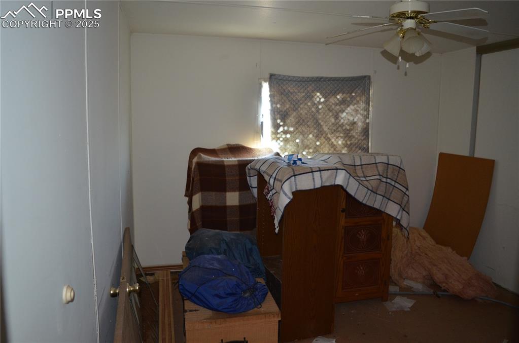 1604 County Road R Rush, CO 80833 - Photo 15 of 16 Bedroom featuring ceiling fan