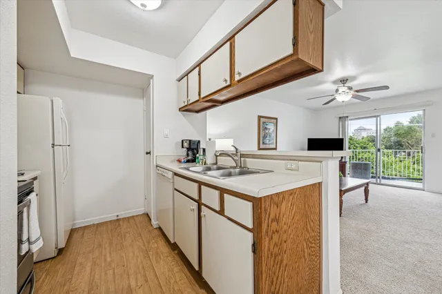 a kitchen with a sink and cabinets