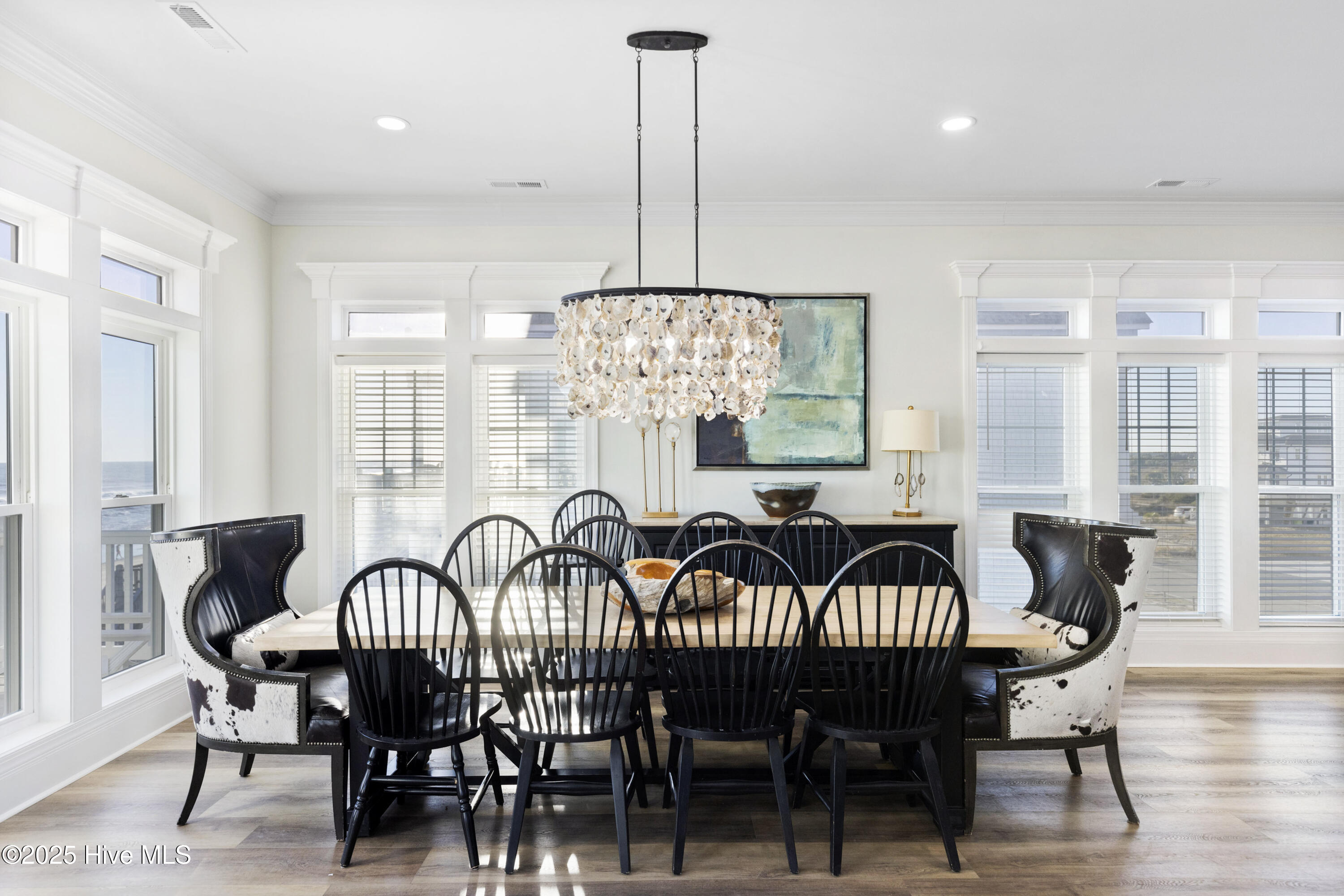Large dining area with statement oyster light