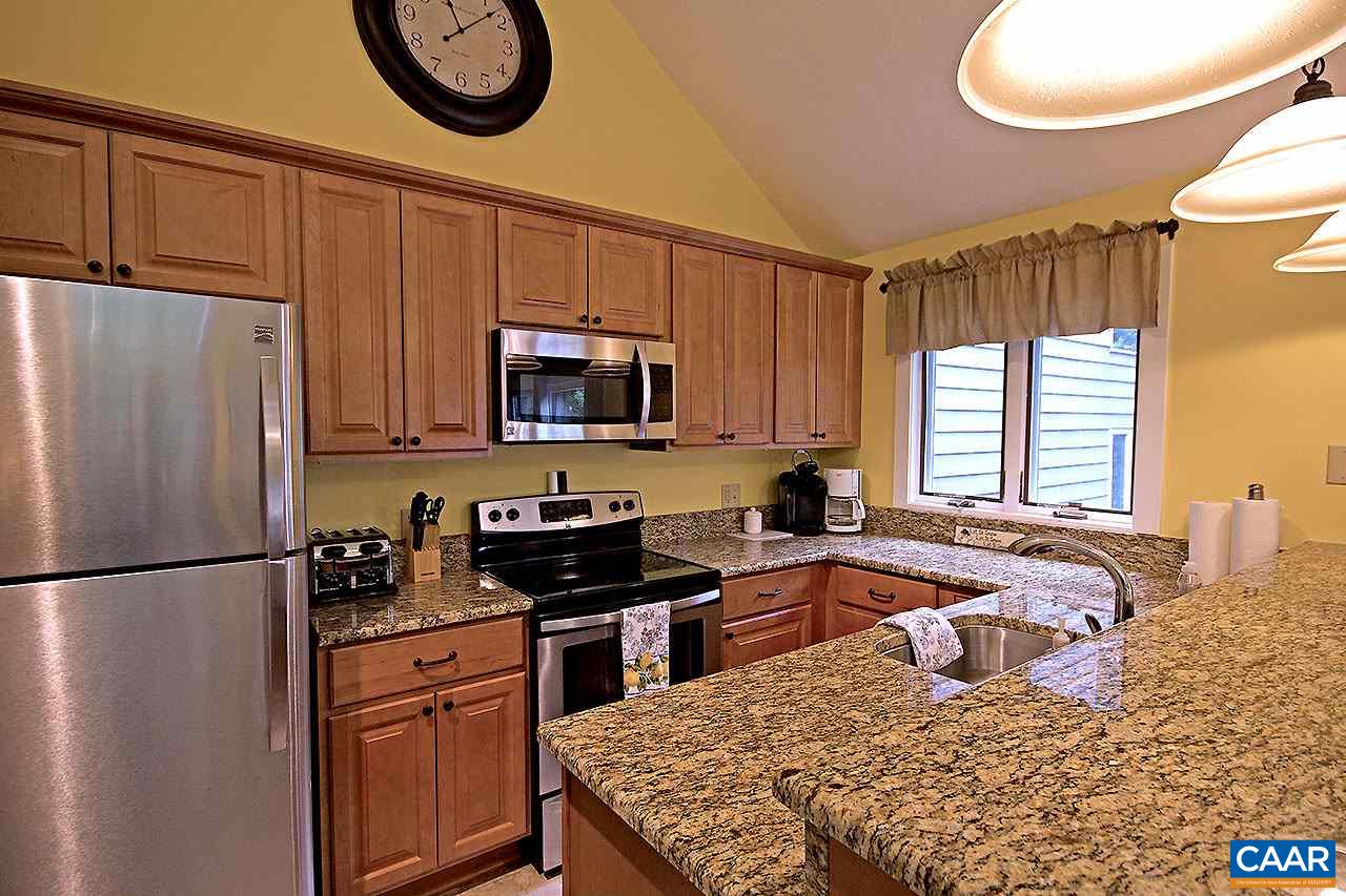 448 Three Ridges Roseland, VA 22967 - Photo 7 of 19 a kitchen with stainless steel appliances granite countertop a refrigerator sink and cabinets
