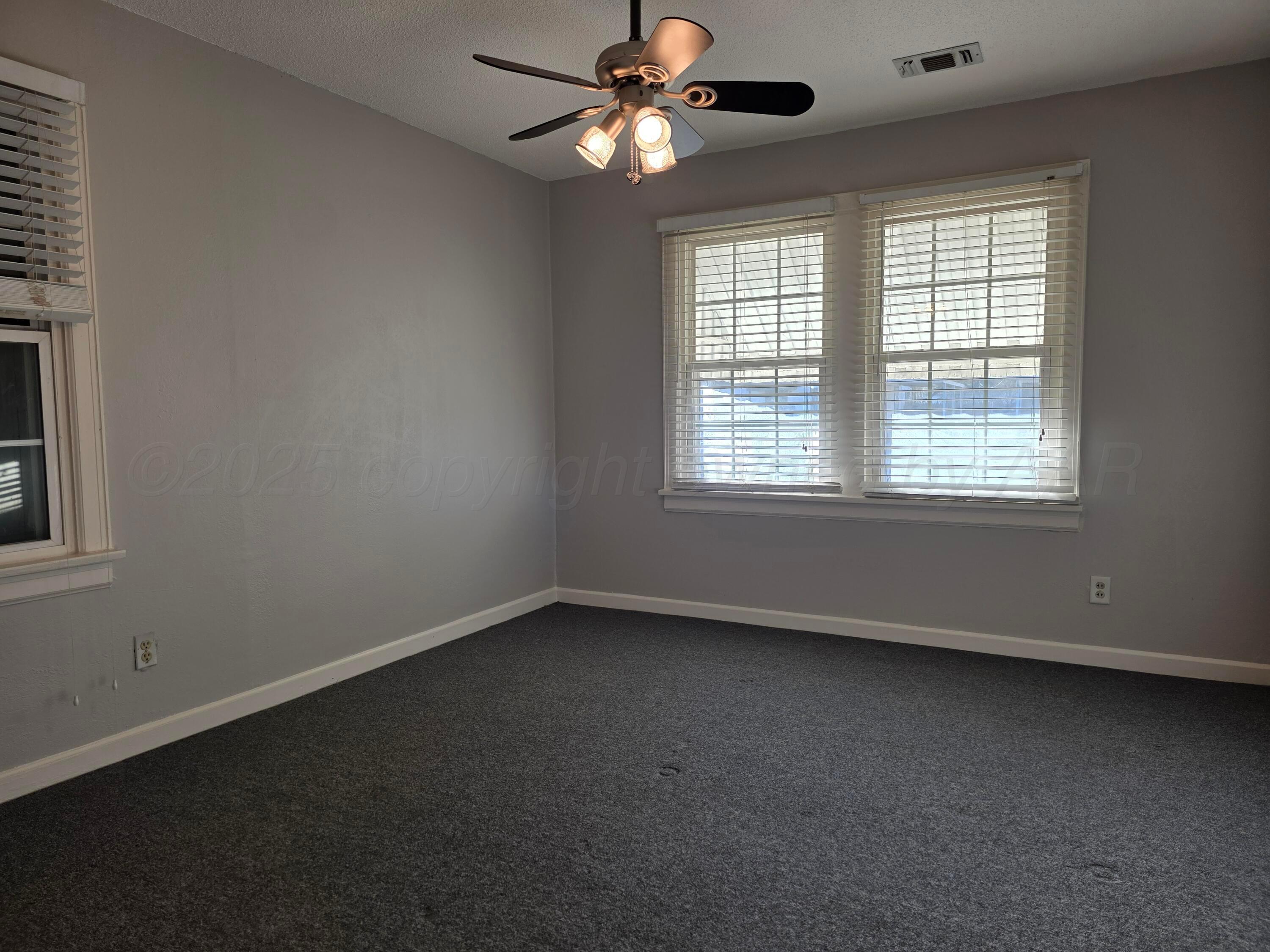 3609 South Jackson Street Amarillo, TX 79110 - Photo 16 of 30 a view of an empty room with a window