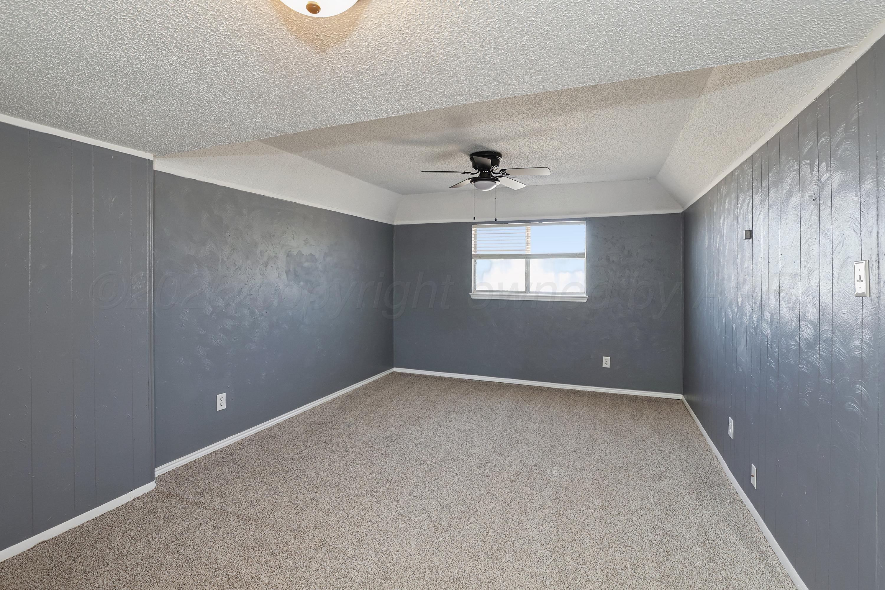 14200 Savannah Road Amarillo, TX 79118 - Photo 16 of 34 a view of an empty room with a window