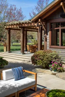 a view of a couches and table in the patio