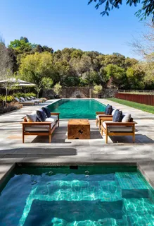 a view of a swimming pool with a patio