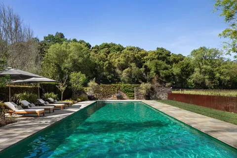 a view of outdoor space with swimming pool and patio