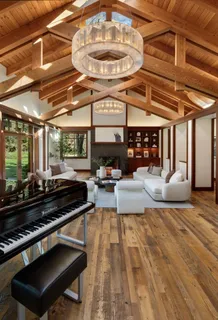 a living room with lots of furniture and a chandelier