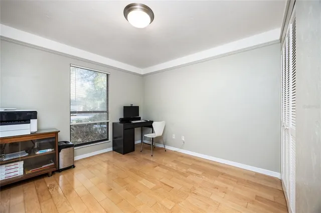 a view of workspace with furniture and windows