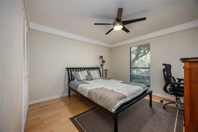 a bedroom with a bed and a table