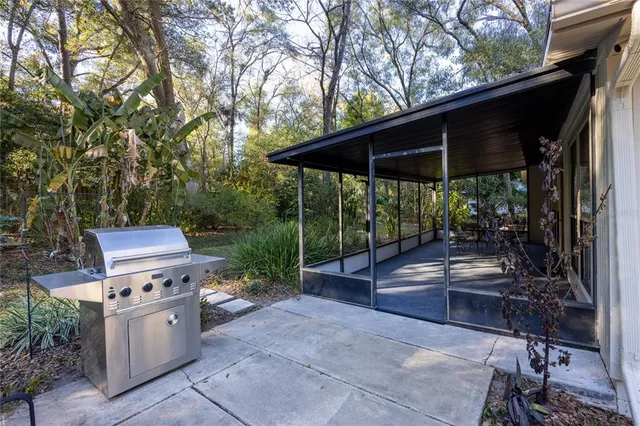 a view of a sitting area with furniture and backyard