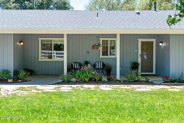 a bed room with a bed and a large window