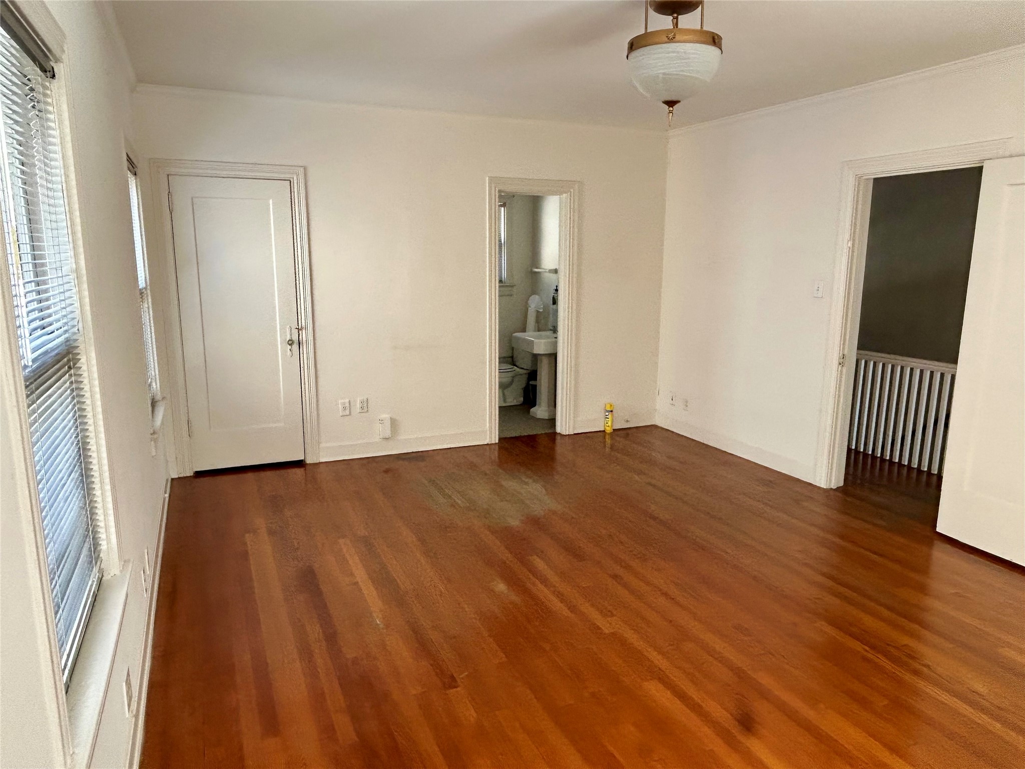 2038 Lexington Street Houston, TX 77098 - Photo 17 of 21 wooden floor in an empty room with a window