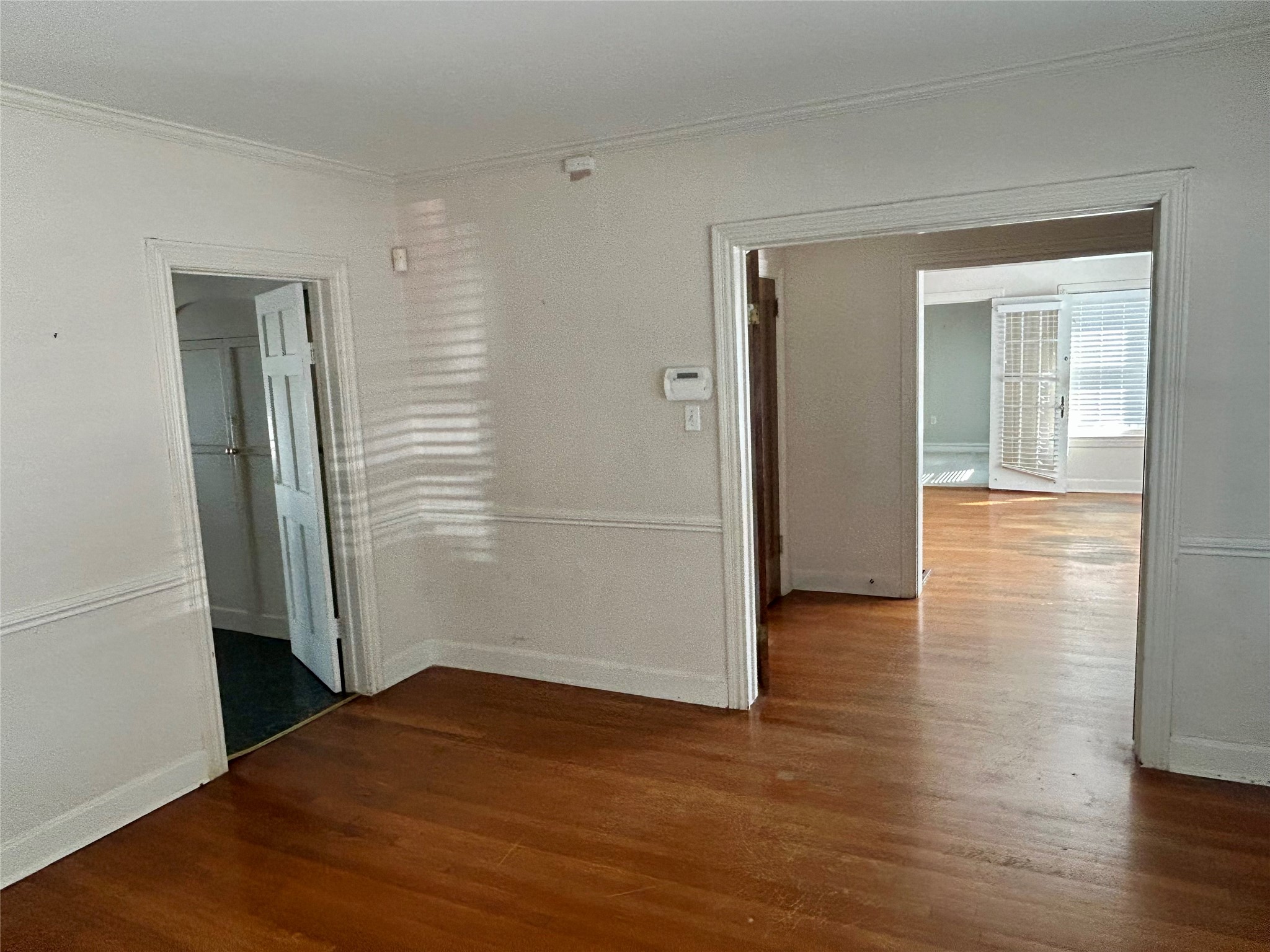 2038 Lexington Street Houston, TX 77098 - Photo 4 of 21 an empty room with wooden floor & closet area